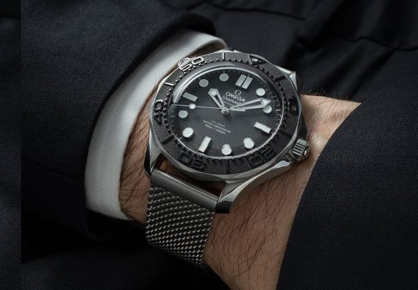 Omega Seamaster Bond replica watch with mesh bracelet on wrist